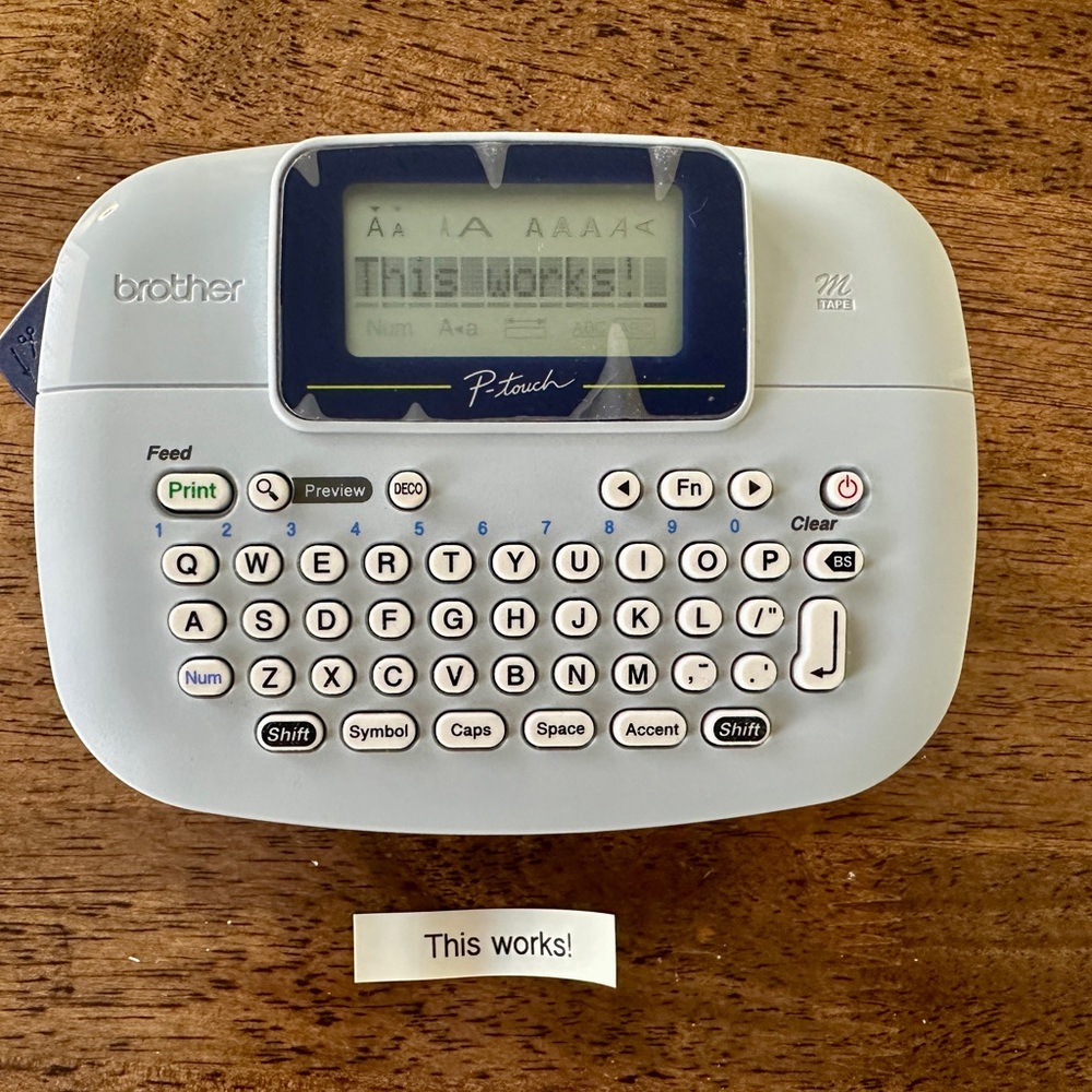 Brother P-Touch M95 Handheld Label Maker + 1 White Label Tape